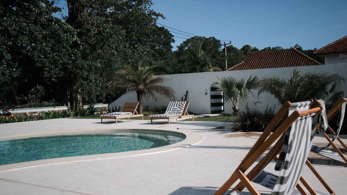 Cancun resort with pool and sunbeds