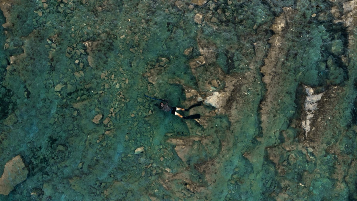 Scuba diver in cenote with clear water