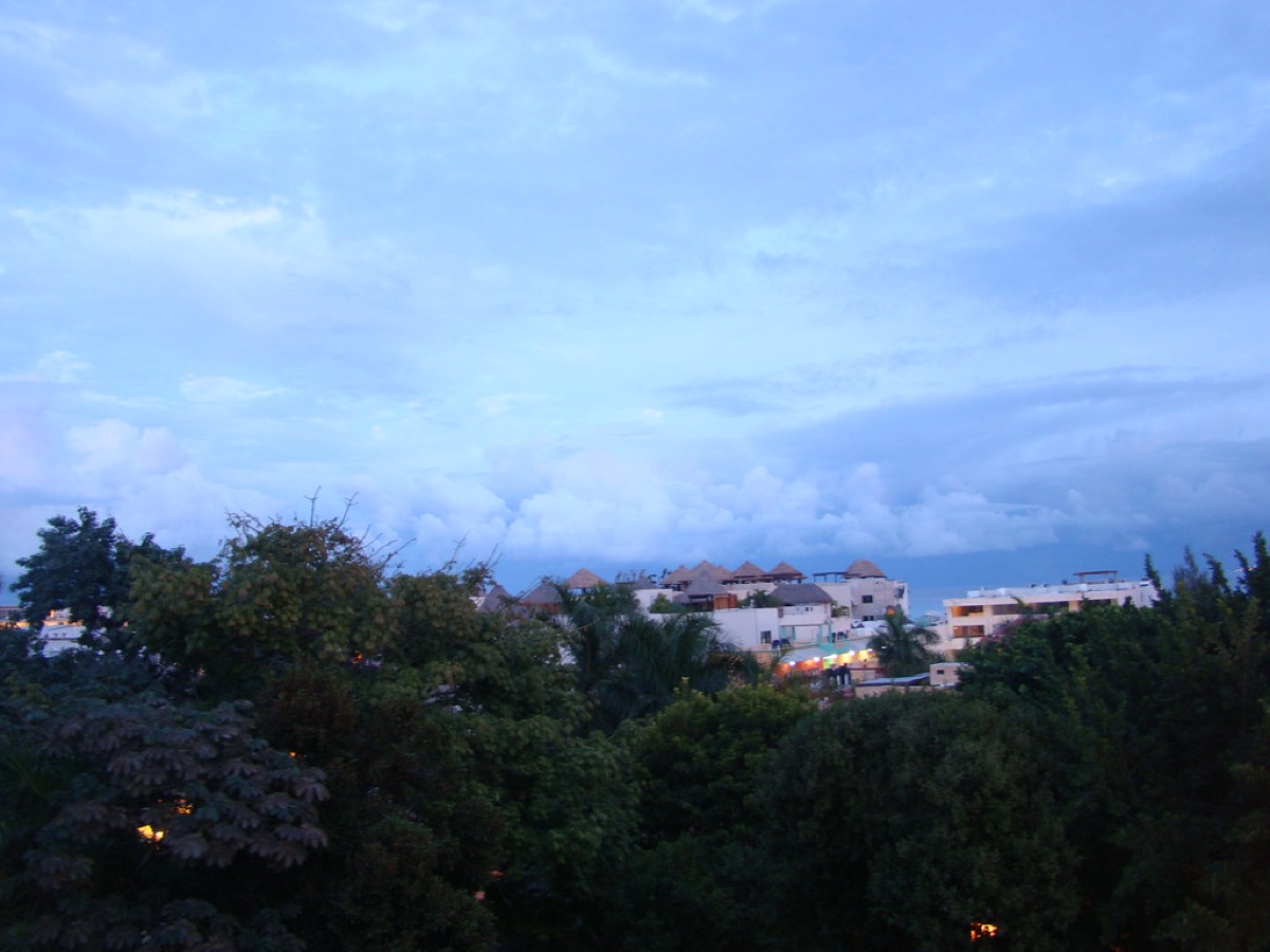 Sunset at Playa del Carmen, Cancun, Mexico, with golden light and turquoise ocean