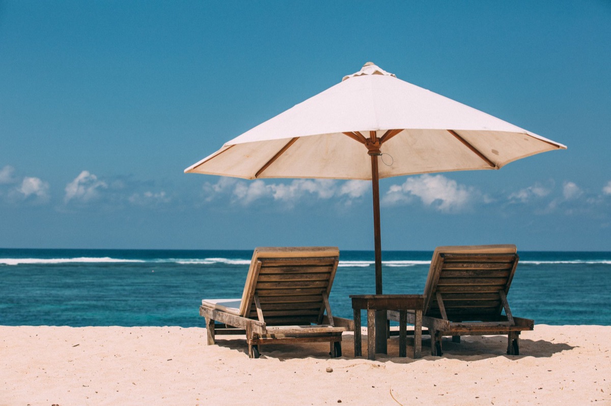 Lounger on a private beach with ocean view