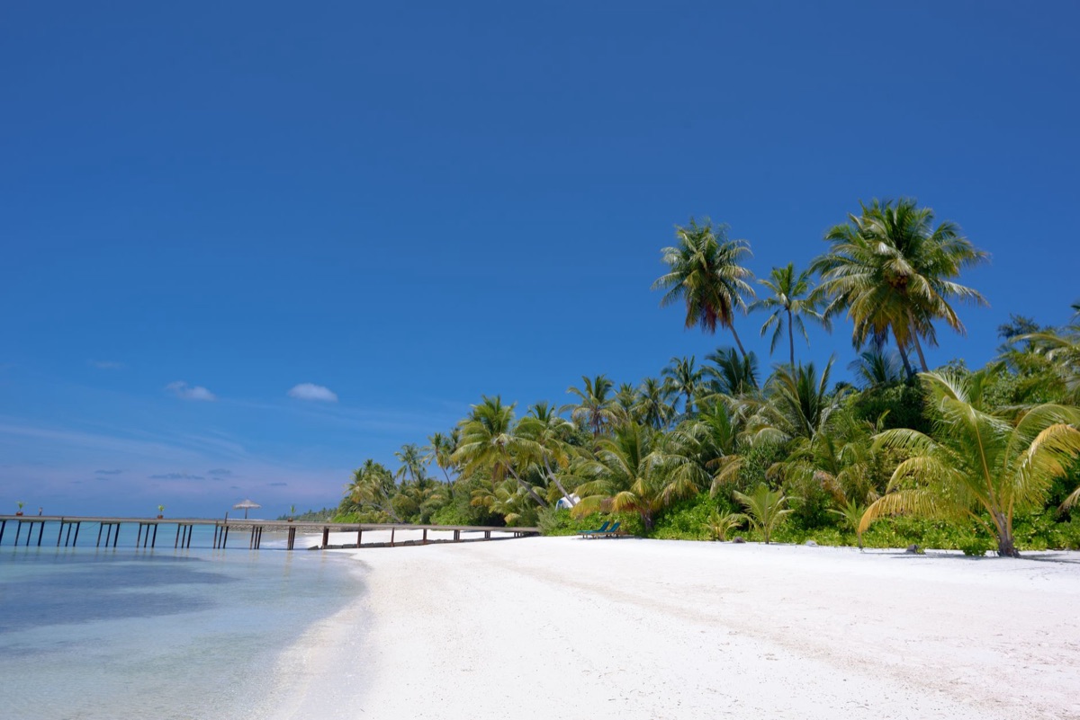 Private beach with white sand and turquoise water