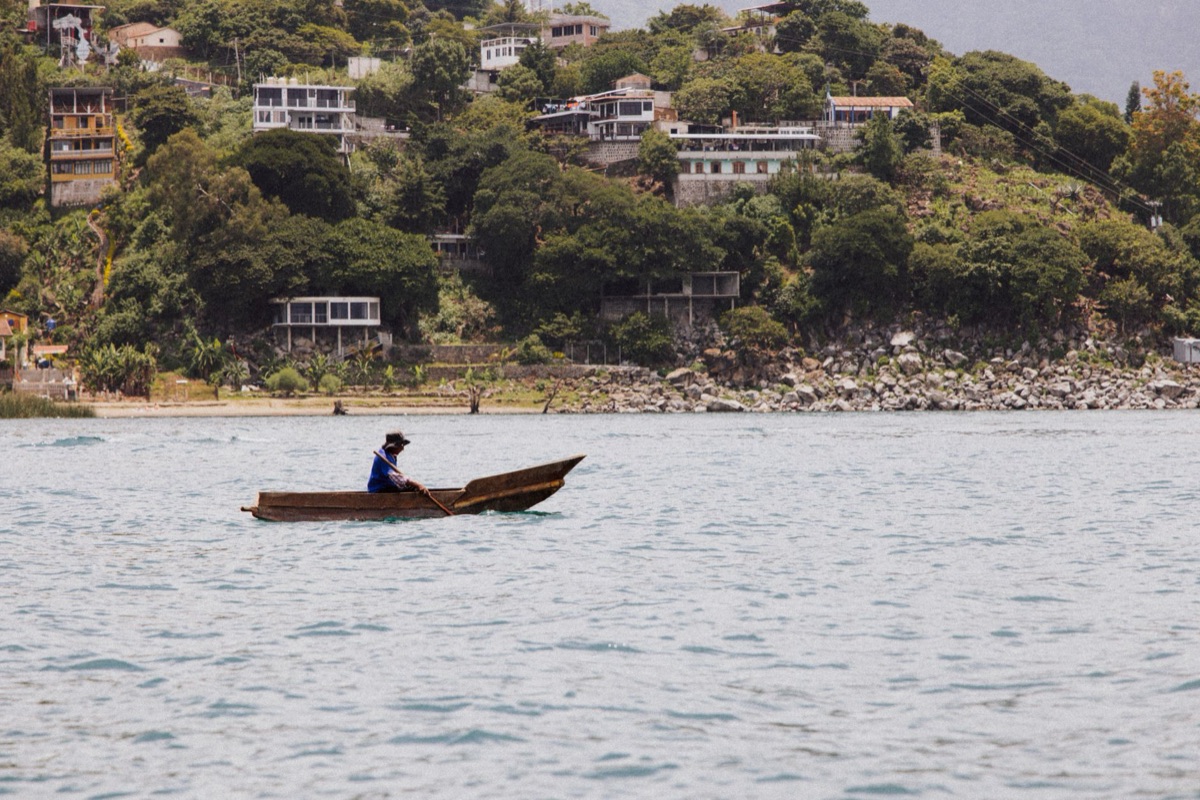 Local fisherman in Saragasso holding a basket of sea vegetables
