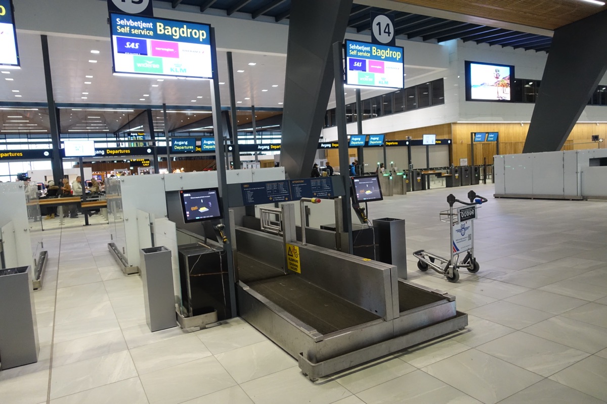 Airport terminal with luggage conveyor belts and baggage handling area
