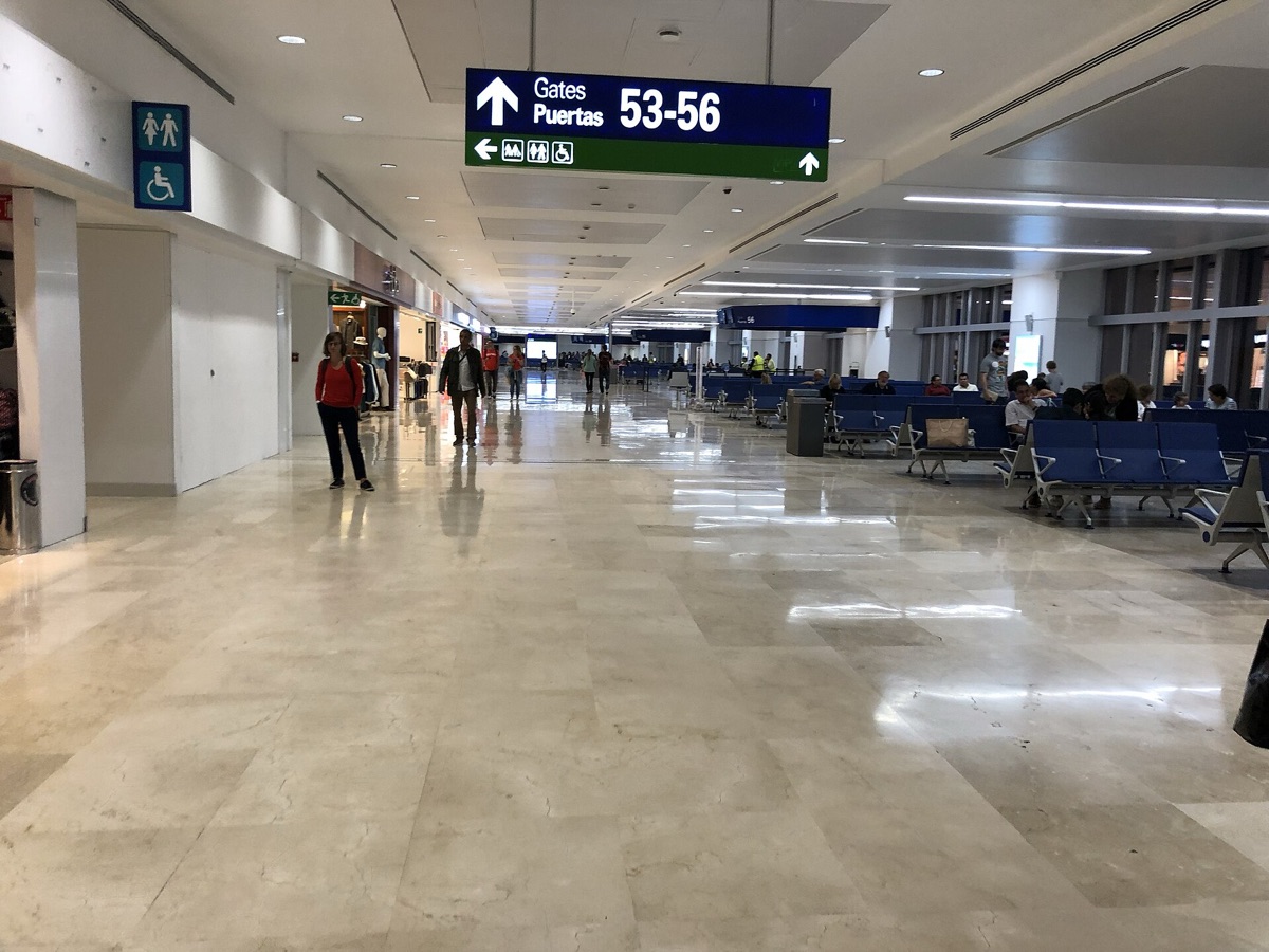Cancun airport terminal with modern architecture and signage